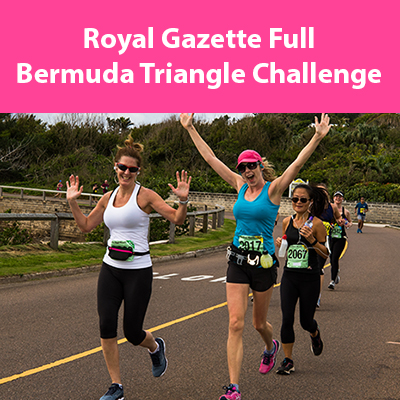 Happy half marathon runners pose for the camera near John Smith's Bay in Bermuda